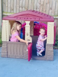 ella and ruthie in the playhouse