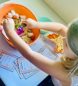 ella plays with easy fall sensory bin