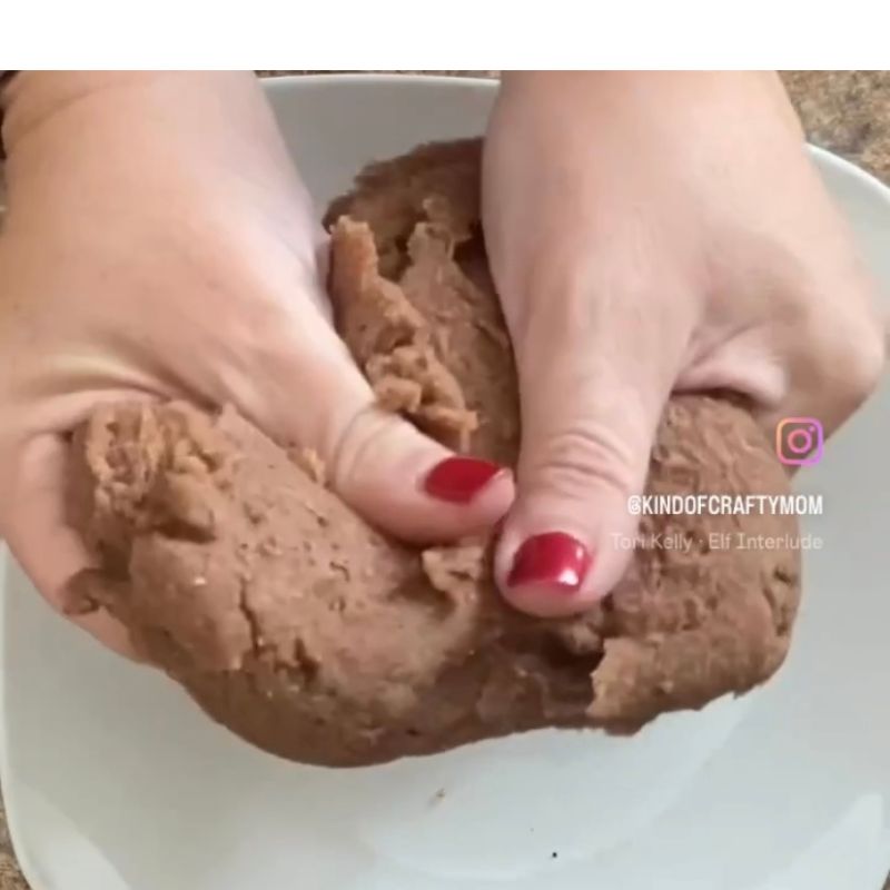 hands squishing gingerbread play dough