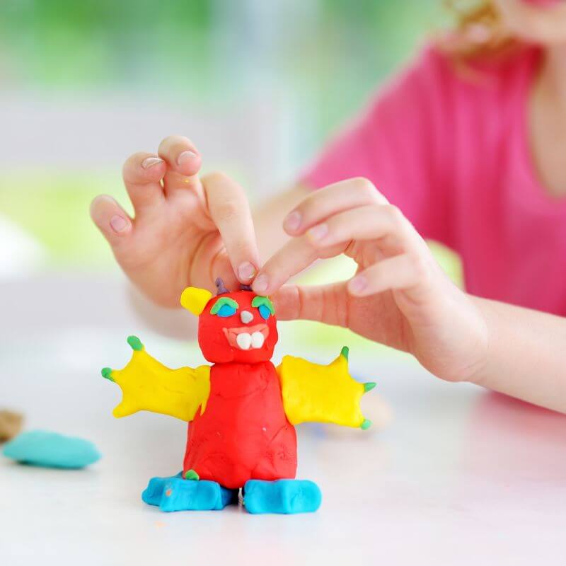 child using modeling clay