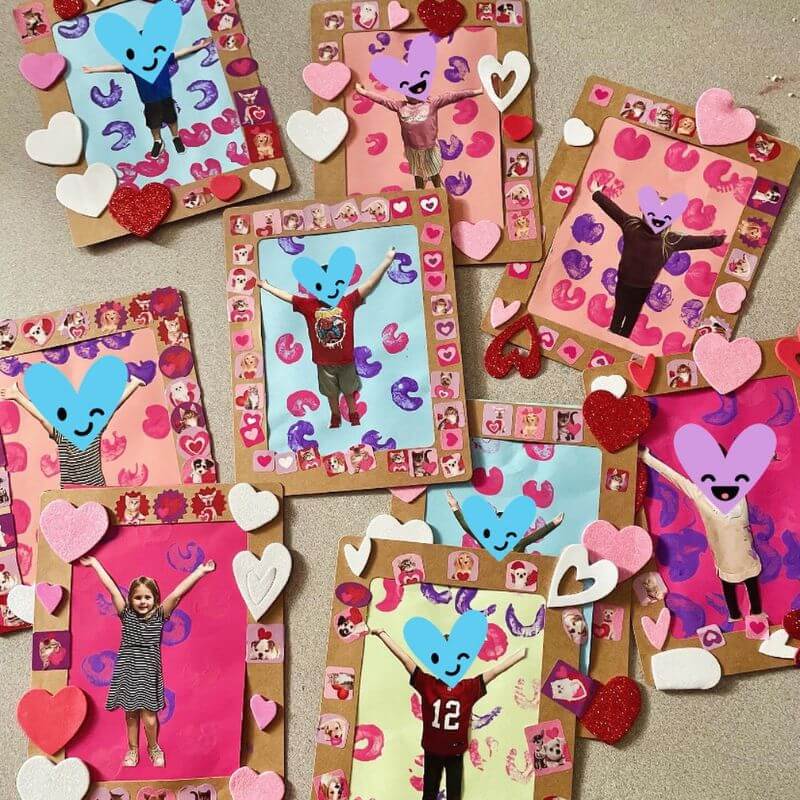 completed picture frames with children's "raining hearts" pictures