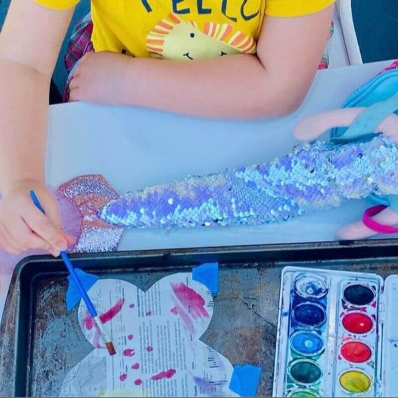 child painting with watercolors