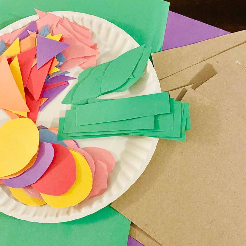 colorful construction paper set up for flower craft