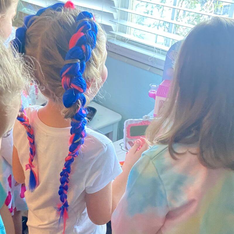 Ella with colorful braids in her hair