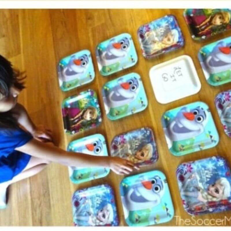 girl playing frozen themed matching memory game