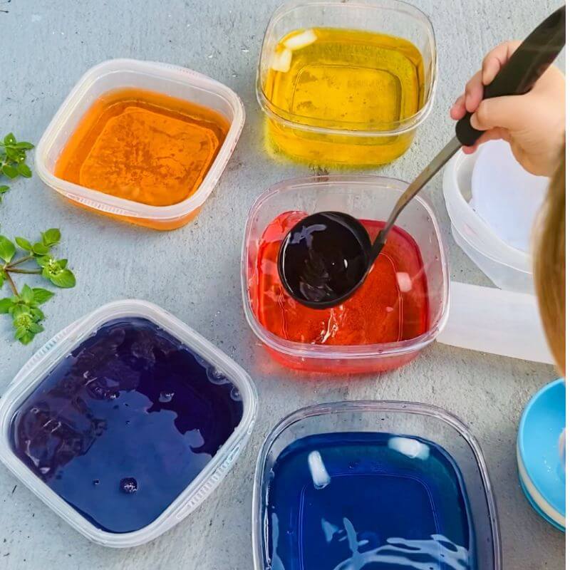 child playing with color mixing activity