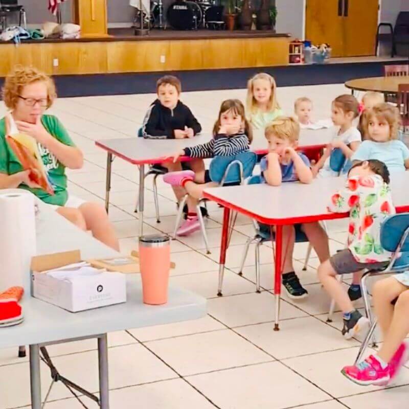 mom reading green eggs and ham to preschool class