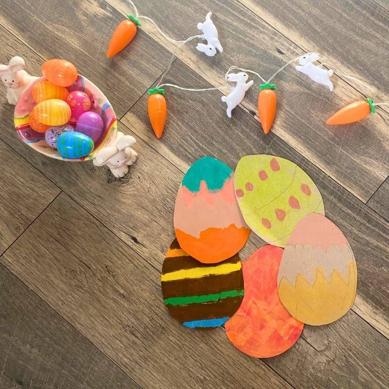 cardboard easter eggs decorated with tempera paint sticks